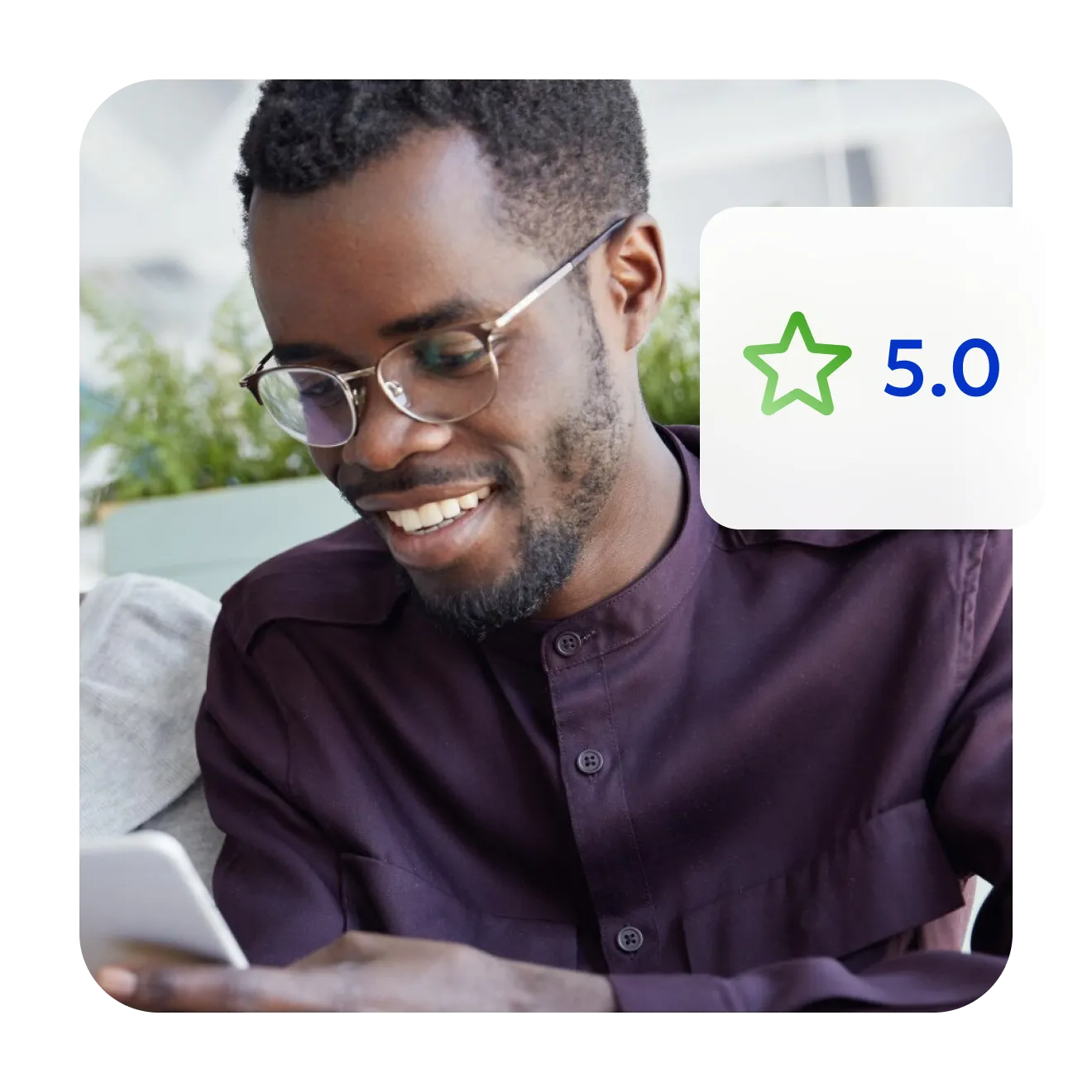 Smiling man in glasses looking at his phone, beside a 5.0 star rating.
